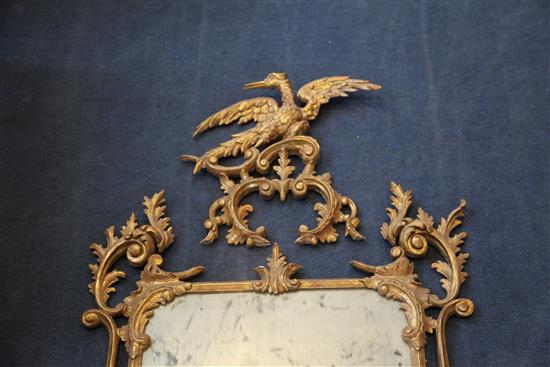 A George III giltwood carved and gesso wall mirror, 4ft 5in x 2ft 3in.